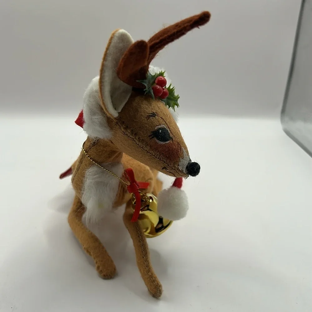 Annalee Reindeer wearing a Santa hat and bell